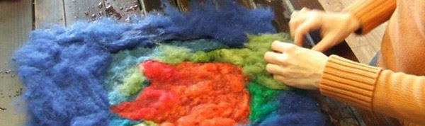 Female hand working with felt